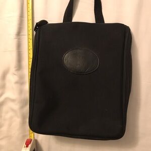 Norm Thompson black hanging toiletry kit. Very good condition.